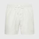 Thumbnail of calvin-klein-med-drawstring-tape-logo-swim-shorts---chalk_562746.jpg