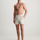 Thumbnail of calvin-klein-medium-drawstring-logo-tape-swim-shorts---stony-beige_537685.jpg